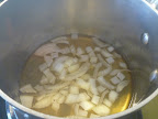 And into the pot goes the vinegar and onion.