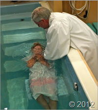 c0 a traditional Baptist baptism ; in this case, the minister is standng outside the baptistery