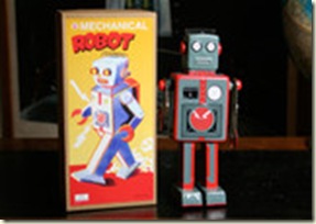 large_grey_and_red_tin_mechanical_robot_compact