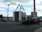 The Solar Water Heting Panels are on their way up to the top of the multi floor apartment building in Kingston.