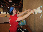 Hanging the sign for the guestbook area.