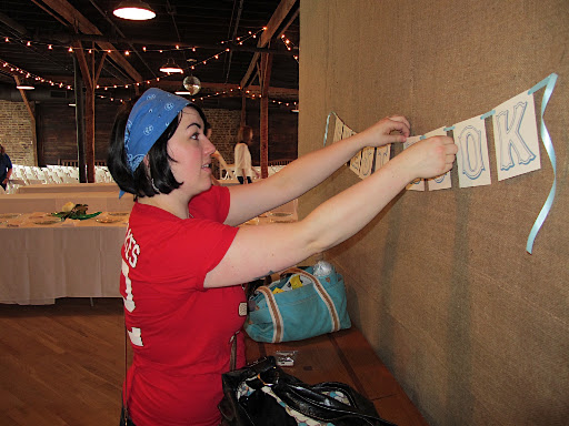 Hanging the sign for the guestbook area.