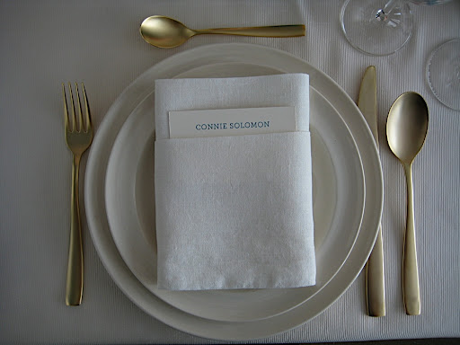 A close up of the place setting, which included the Midas Gold flatware from The Conran Shop, and a sweet little place card tucked into the napkin.