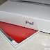 Our iPad 2 in the box, with Produce Red Smart Cover