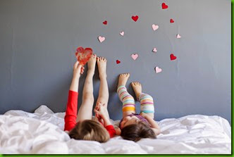 crystal-hardins-image-of-these-two-sisters-feet-on-wall-with-hearts