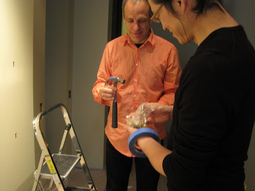 David and Atsushi begin the process of rehanging the Albers.