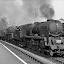 Bradford - Bournemouth Express Pounding Through Midsomer Norton South Station
view Northward, Towards Bath: Ex-somerset & Dorset (midland & Lsw Joint) Line, Bath (green Park) - Templecombe - Bournemouth West. it is a Summer Saturday and the Heavy 07.40 From Bradford (forster Square) Has Reversed at Bath (dep. 14.50)and is Due at Bournemouth West at 17.35. it Needs Two Large Locomotives to Tackle the Heavy Gradients, Here the Long Climb From Radstock Up to Masbury. Sr Rebuilt Bulleid Light Pacific No. 34048 'crediton' (built 11/46 as 21c148, Rebuilt 3/59, Withdrawn 3/66) is Piloting BR Standard 5mt 4-6-0 No. 73019 (built 11/51, Withdrawn 1/67). 

this Image From Http://www.geograph.org.uk/photo/2669385 is Licensed Under the Creative Commons Attribution-share Alike 2.0 Generic License. by Ben Brooksbank ( Http://www.geograph.org.uk/profile/44502 )