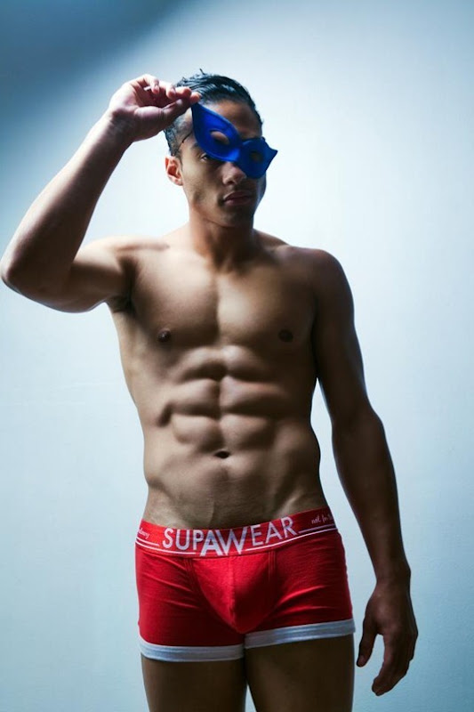 male model in mask and brief