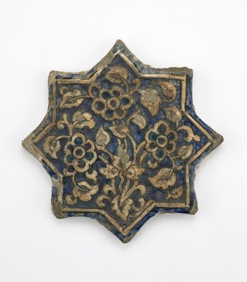 Tile | Origin:  Iran | Period: 14th century  Il-Khanid period | Details:  Not Available | Type: Stone-paste, molded and painted under glaze | Size: H: 2.2  W: 23.8  cm | Museum Code: F1903.200 | Photograph and description taken from Freer and the Sackler (Smithsonian) Museums.