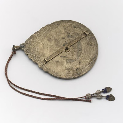 Astrolabe | Origin:  Iran | Period: late 19th century | Details:  Not Available | Type: Brass | Size: H: 17.7  W: 12.9  cm | Museum Code: F1945.6 | Photograph and description taken from Freer and the Sackler (Smithsonian) Museums.