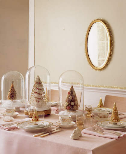 Ornamented and gilded brush trees provide the theme for a holiday table and complement the glistening trim on the dishware. The 1960s trees beneath the glass are highly sought, running $100 and up. Ornamented and gilded brush trees provide the theme for a holiday table and complement the glistening trim on the dishware. The 1960s trees beneath the glass are highly sought, running $100 and up.