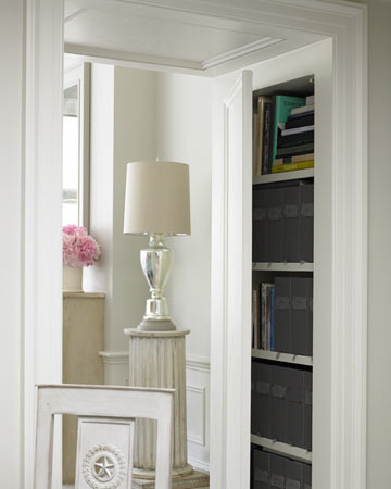 Between the dining and living rooms, deep doorways allow for closets behind panels; these hold books, electronics, and kitchen supplies. Between the dining and living rooms, deep doorways allow for closets behind panels; these hold books, electronics, and kitchen supplies.