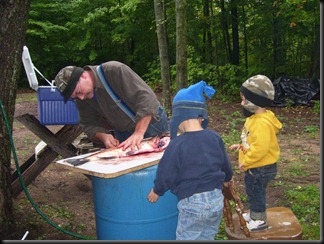 Grandpa cleaning salmon