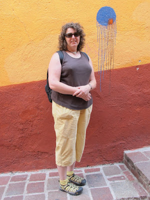 Renee in brown and ochre, with blue spot