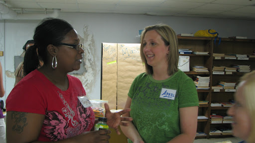 Before the art class begins, Tonya Carlock (left) and April Hansen discuss the day's activities.