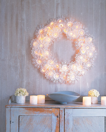This wreath is completely made out of doilies and Christmas lights.