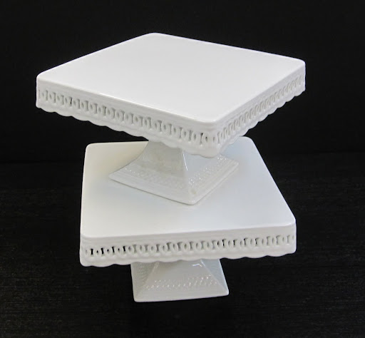 These are two cake stands stacked on top of one another. Their design is very elegant and romantic.