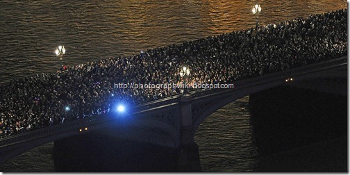 Crowds gathered on Westminster Bridge in central London as they wait for New Years Eve fireworks to be set off