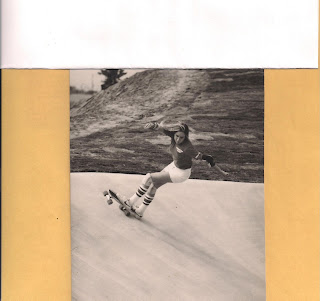 A smooth carve at a skate park bowl.