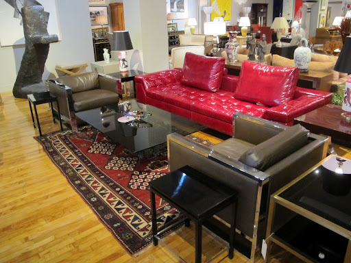 A sofa designed by Casa Desus in pomegranate patent leather - how fun! I love how it gives a modern twist to the older rug beneath.