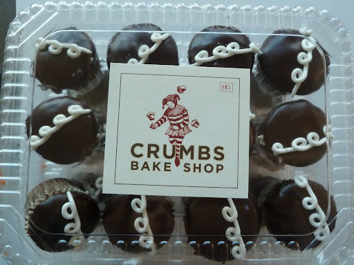 The sweets were from all over, to showcase the couple's love of chocolate and their black and white theme. These mini cupcakes from Crumbs Bake Shop were a nod to the classic sweet, loved by the groom.