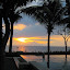 Sunset by the pool with Gunung Agung (Bali) in the background