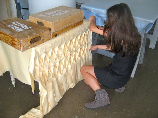 Assistant style editor, Erin Furey, is creating a similar look to Wendy's cake for the table with fabric.