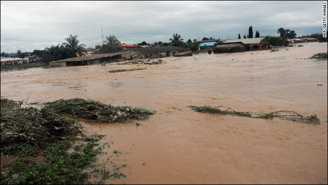 Floodwaters course through Odo Ona in Nigeria's Oyo State in 2011. At least 102 people were killed when a dam burst during torrential rain. Photo: AFP / Getty Images