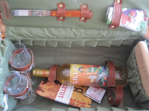 Oh joy! The perfect picnic basket; it has anything you'll ever need, with a cutting board, cheese spreader, napkins, glasses, and Lillet blanc.