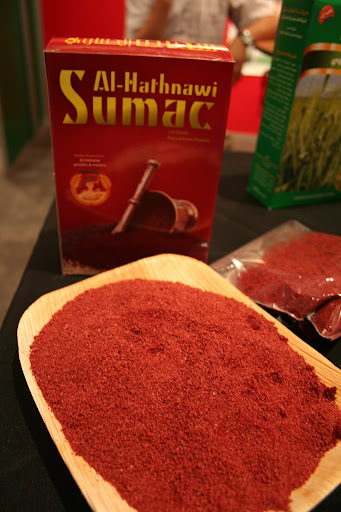 If za'atar is old hat for you, here's another Middle Eastern/North African spice to try: sumac.  It's the key to adding lemony flavor to many dishes, from everyday hummus to the Palestinian chicken dish Musakan.