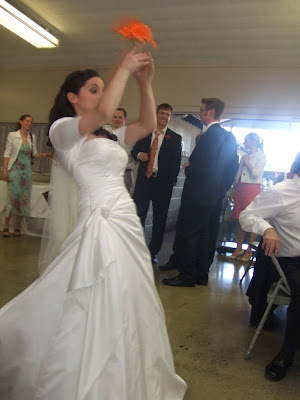 Alex Tosses the Bouquet to the Crowd of Single Ladies