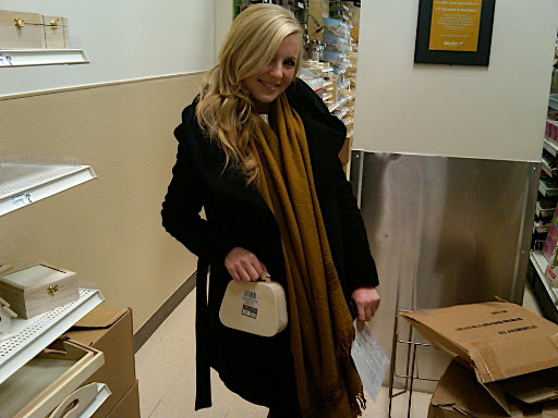 Britni struck a pose with a little wooden purse in the wood crafts aisle.
