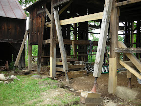 Three of the four post feet on this wall required repair due to extensive rot