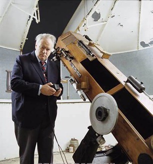 Patrick Moore with telescope in his observatory