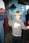 Cruz wearting the spectacled bear paw, Hector's house, Amazonas, Peru
