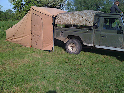 The awning fits snugly over the top of the 110 HCPU pickup - it is the right height for most landrovers, and has a single centre guy rope which secures the awning to the vehicle.
