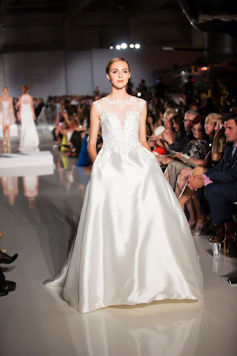 Like us, Enzoani's design team is loving 1950's full skirts and high necklines. Case in point: this full skirted gown with an illusion neckline. Like us, Enzoani's design team is loving 1950's full skirts and high necklines. Case in point: this full skirted gown with an illusion neckline.