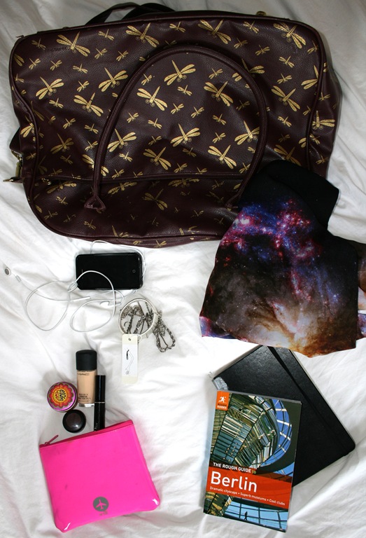 1) Iphone 2) Make-up bag 3) Rough guide to Berlin and Moleskine sketchbook 4) Galaxy print scarf by Christopher Kane 5) Amelie armlet by CULIETTA 