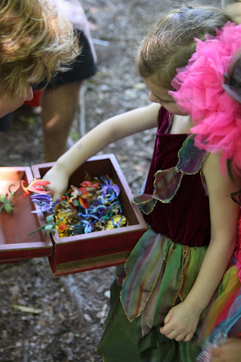 A treasure chest full of mythological creatures and gold chocolate coins.
