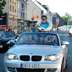 A lap of honour in a sportscar to celebrate the victory. Rhys Pollock from the Trek – Marco Polo Cycling Team wins the GP Möbelstadt Rück Oberhausen in Germany. (Photo: Francis Cerny)
