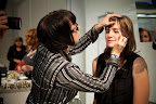 Here one of the photographers gets her eye makeup done.