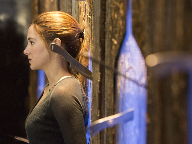 Shailene Woodley plays Beatrice Prior in the movie Divergent (March 2014), based on the dystopian young adult novel by Veronica Roth. The hugely popular book contains themes of economic struggle and class warfare. Photo: Jaap Buitendijk / Summit