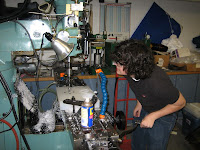 A student inspects the CNC machine