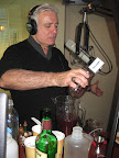 Dale mixing ingredients for the first cocktail.