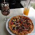 Our snack table at K1 Cafe: Iced Mocha, Eduardo's Pizza, and Pineapple Orange Juice