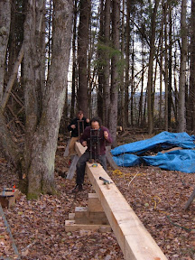 Skip and Roger use boring machines to add mortises to a new sill.