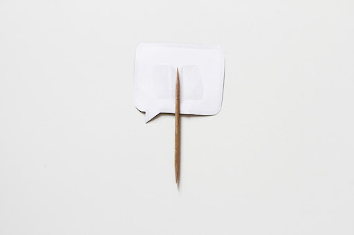 3. Tape or glue toothpicks to the back of each speech bubble.