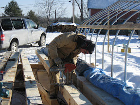 Seth Kelley adds a mortise to one of the plates.