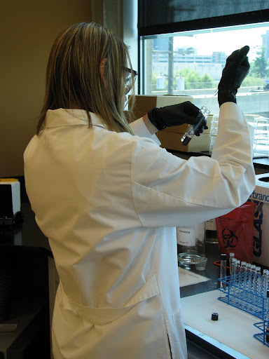 A toxicology technician preparing blood samples. (Photo credit: Jeremy Shreckhise)