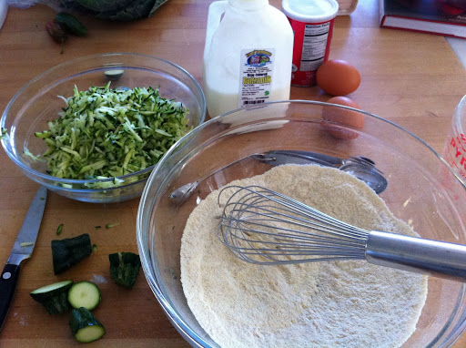 Whisk together 1 cup all-purpose flour, 1/2 cup medium or fine-ground cornmeal, 1/4 cup grated Parmesan (or not), 2 tsp salt and 1/2 tsp baking powder. In a measuring cup, whisk together 1 cup buttermilk, 3 eggs, and 2 medium zucchini, shredded. Whisk together 1 cup all-purpose flour, 1/2 cup medium or fine-ground cornmeal, 1/4 cup grated Parmesan (or not), 2 tsp salt and 1/2 tsp baking powder. In a measuring cup, whisk together 1 cup buttermilk, 3 eggs, and 2 medium zucchini, shredded.